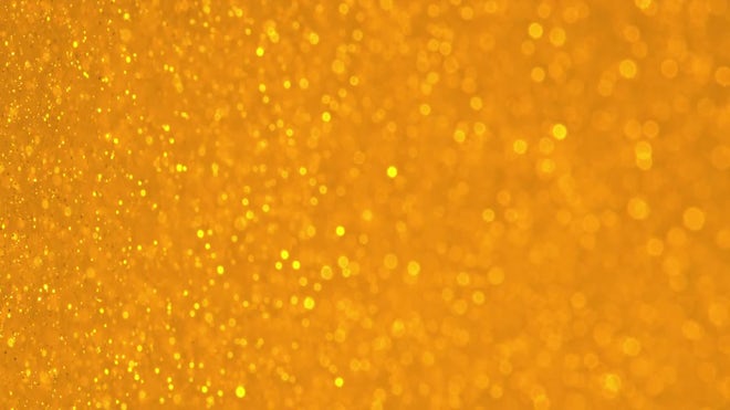 Glittering Golden Particles With Bokeh.